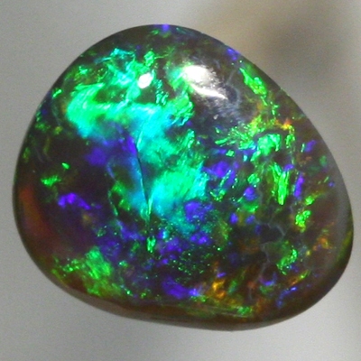 SOLID BLACK OPAL Pretty! Sparkling and bright gemmy green fire. SEE VIDEO